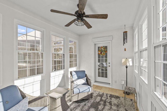 sunroom / solarium with ceiling fan