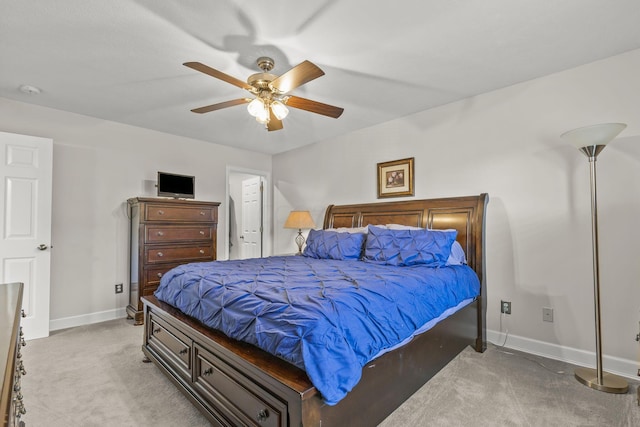 bedroom with light colored carpet and ceiling fan