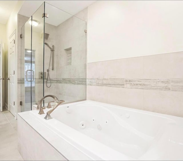 bathroom with plus walk in shower and tile patterned floors