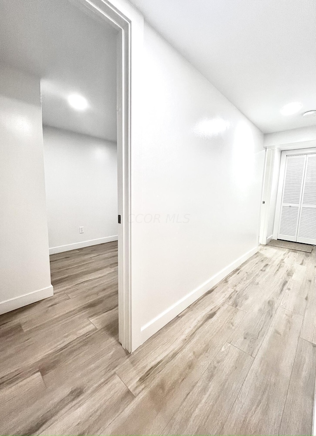 spare room featuring light hardwood / wood-style floors