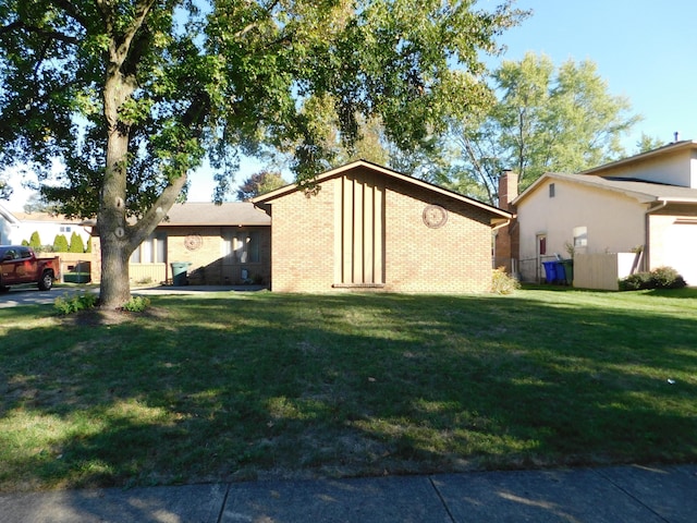 view of property exterior featuring a yard