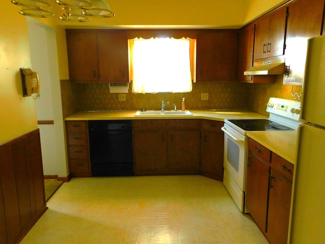 kitchen featuring white appliances, backsplash, and sink