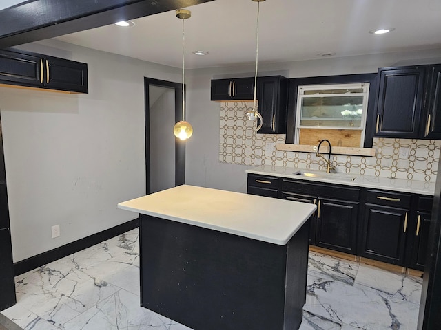 kitchen featuring backsplash, a center island, sink, and hanging light fixtures