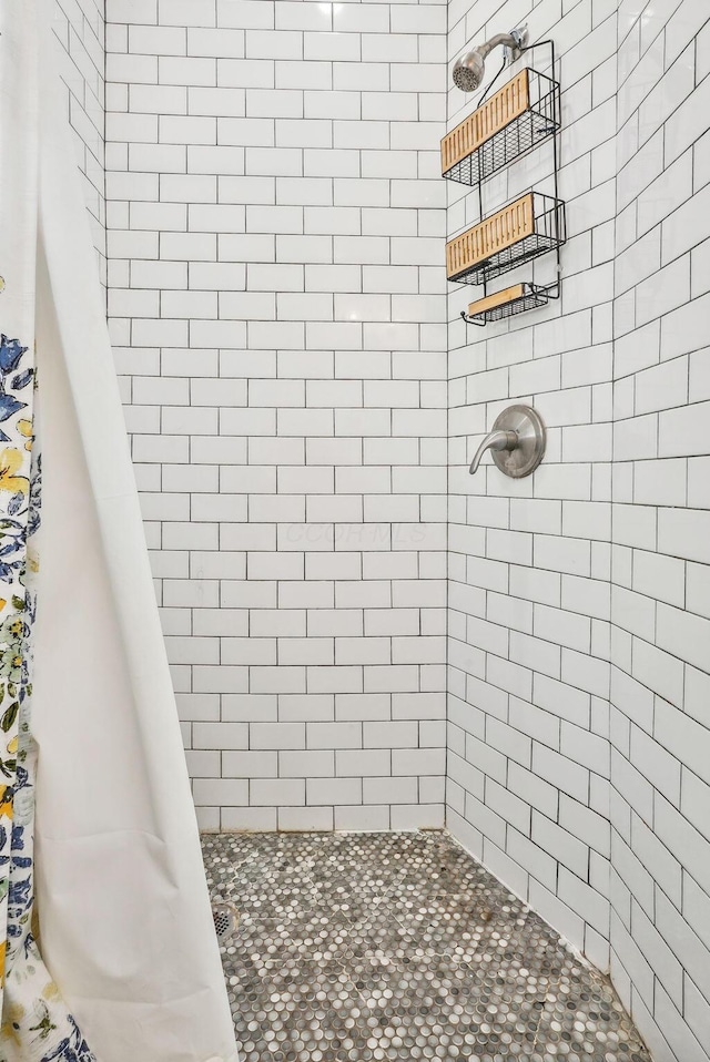 bathroom with a shower with shower curtain