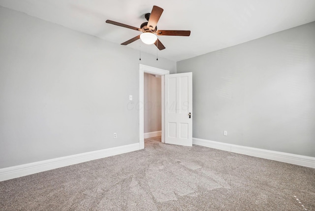 unfurnished bedroom with ceiling fan and carpet flooring