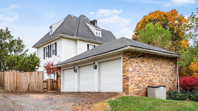 view of property exterior featuring a garage