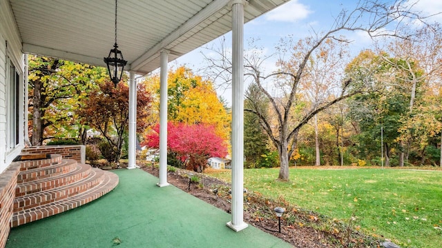 view of yard featuring covered porch