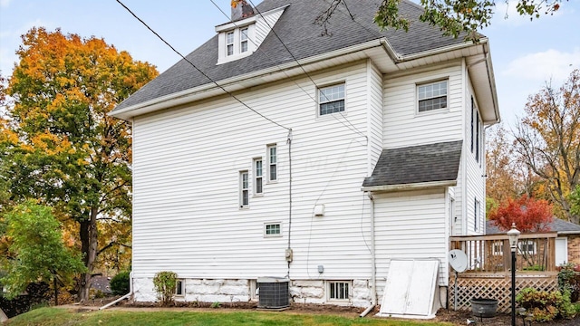 back of house featuring a yard, a deck, and cooling unit