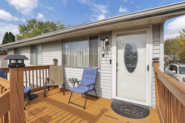 entrance to property with a deck