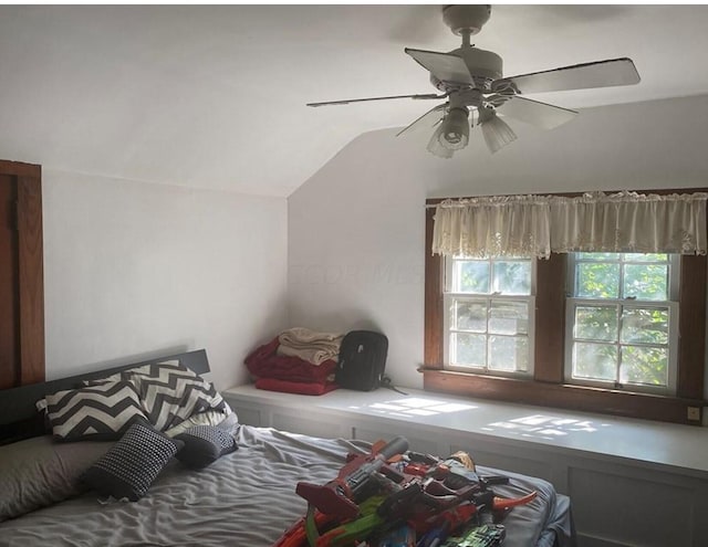 bedroom with ceiling fan and lofted ceiling