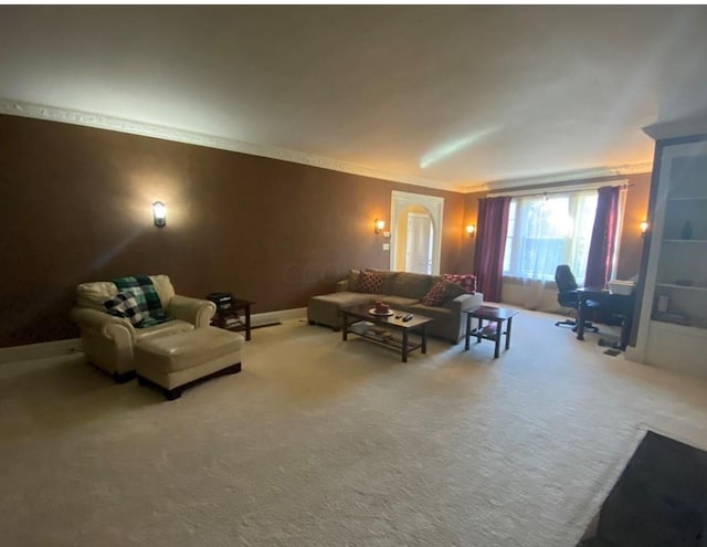 living room with carpet flooring and ornamental molding