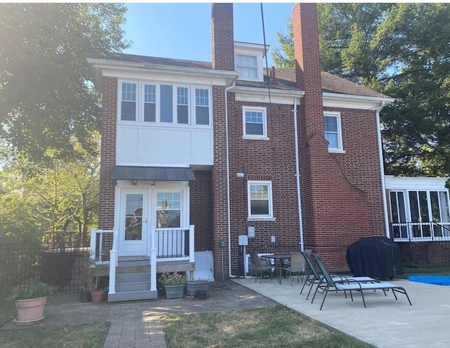 back of house with a patio area