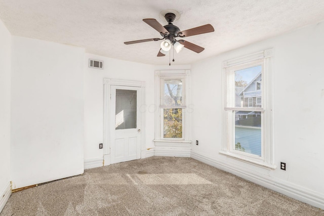 2402 E Ave, Columbus, OH 43202 - spare room with carpet floors, a textured ceiling, and ceiling fan