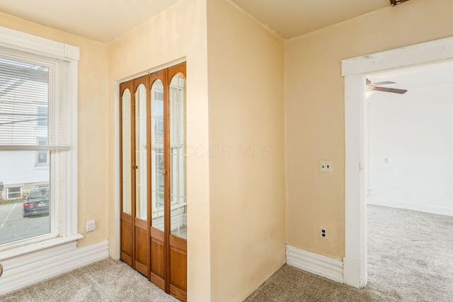 2402 E Ave, Columbus, OH 43202 - carpeted entryway with ceiling fan and baseboards