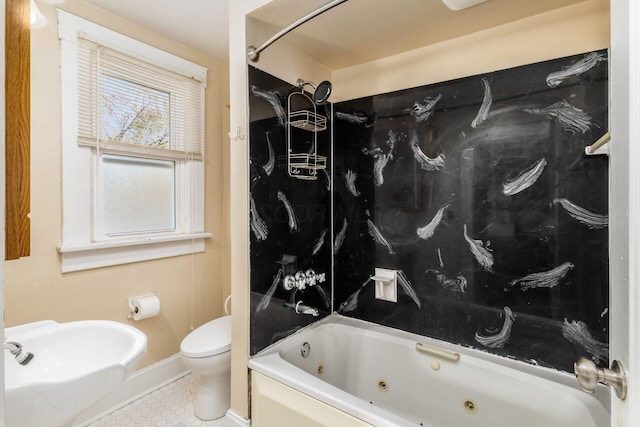 2402 E Ave, Columbus, OH 43202 - bathroom with baseboards and a combined bath / shower with jetted tub
