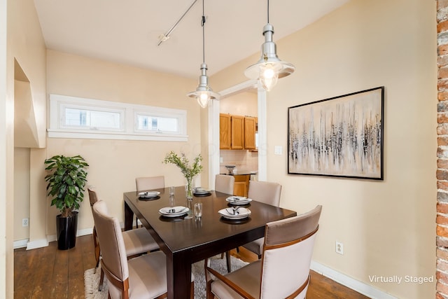 2402 E Ave, Columbus, OH 43202 - dining room featuring dark wood-style flooring and baseboards