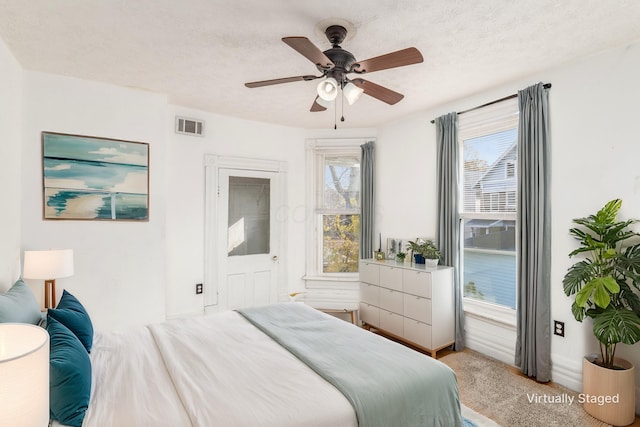 2402 E Ave, Columbus, OH 43202 - bedroom featuring light colored carpet and ceiling fan