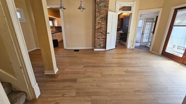 2402 E Ave, Columbus, OH 43202 - unfurnished living room with wood finished floors and stairs
