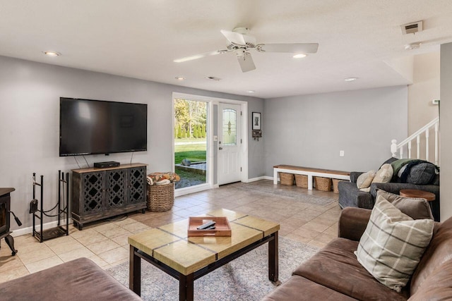 living room featuring ceiling fan and light tile patterned floors