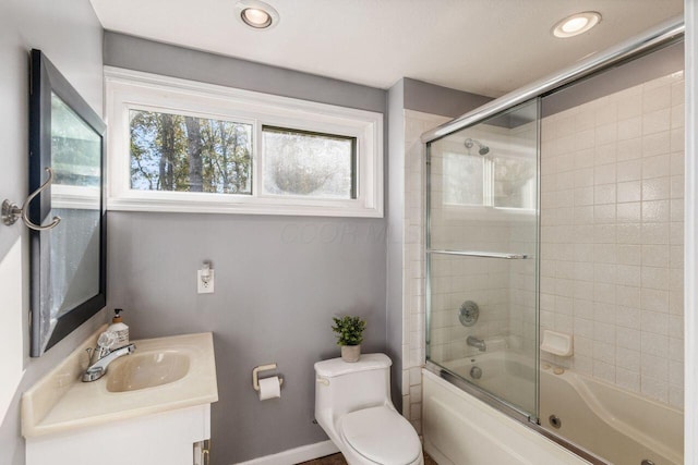 full bathroom with vanity, toilet, and enclosed tub / shower combo