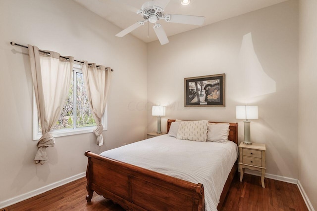 bedroom featuring ceiling fan and dark wood-type flooring