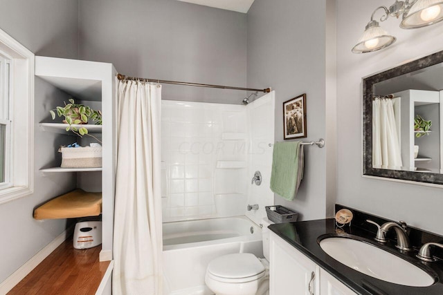 full bathroom with hardwood / wood-style floors, shower / bath combination with curtain, toilet, and vanity