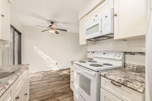 kitchen featuring white cabinets, white appliances, dark hardwood / wood-style floors, and tasteful backsplash