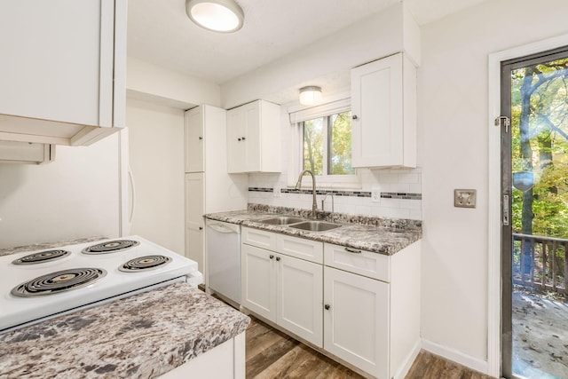 kitchen featuring white cabinets, white appliances, sink, and a wealth of natural light