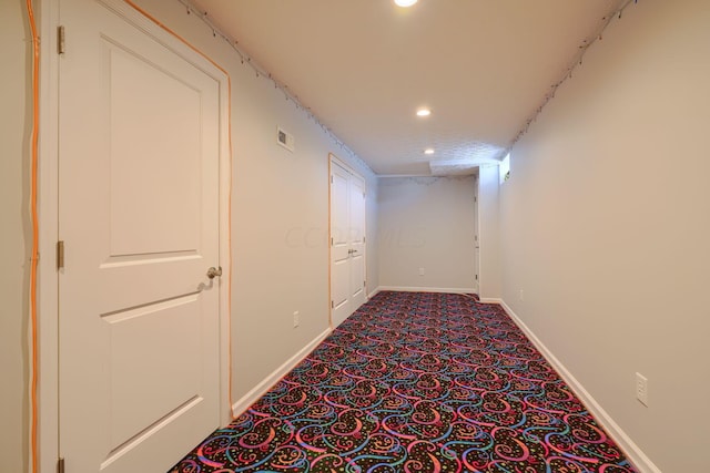 corridor with carpet flooring