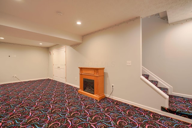 basement featuring carpet flooring