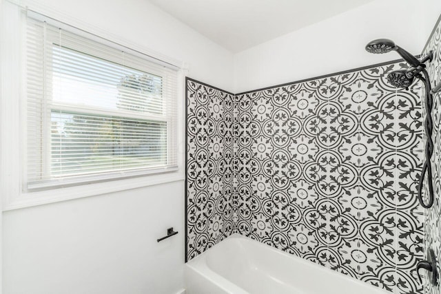 bathroom featuring washtub / shower combination