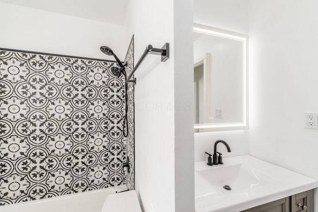 bathroom with vanity and shower / bath combination