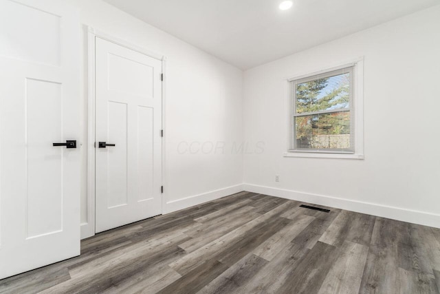 spare room featuring hardwood / wood-style floors