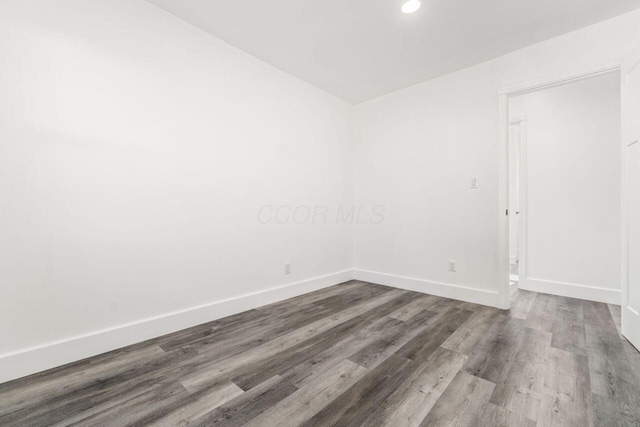 unfurnished room featuring wood-type flooring