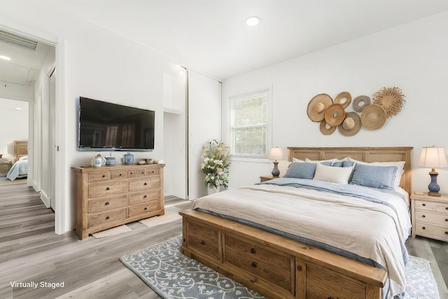 bedroom featuring hardwood / wood-style floors