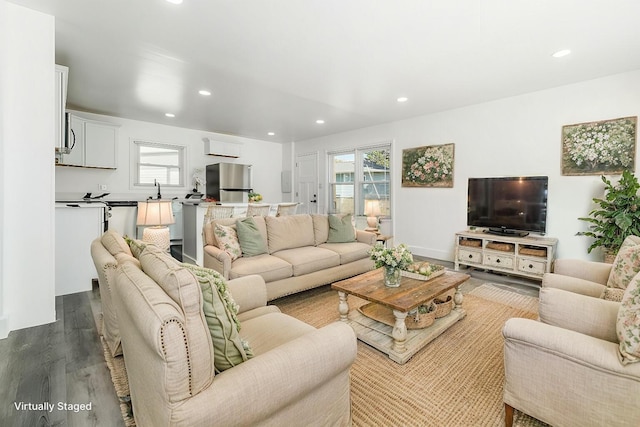 living room with light wood-type flooring and sink