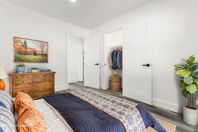 bedroom featuring dark hardwood / wood-style flooring and a closet