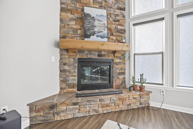 interior details featuring hardwood / wood-style flooring and a fireplace