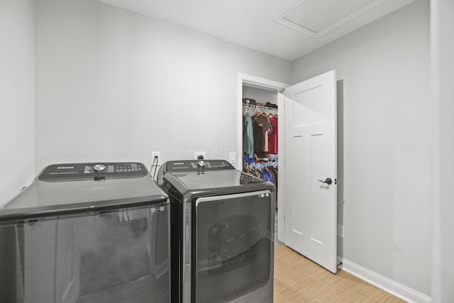 laundry area with independent washer and dryer