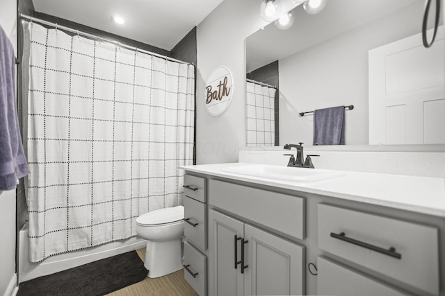 full bathroom featuring vanity, toilet, and shower / tub combo