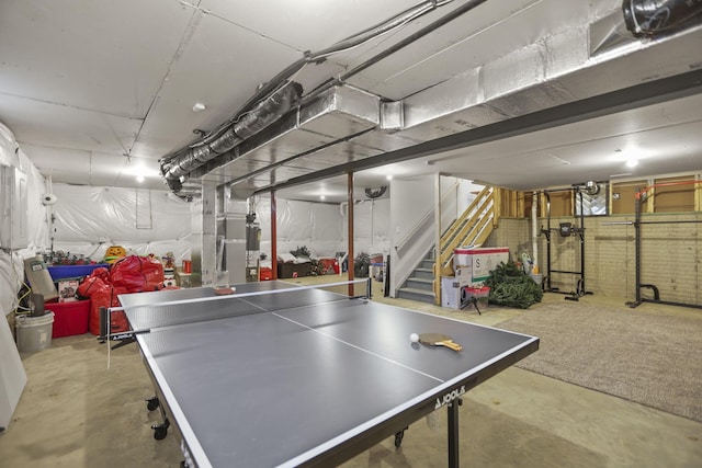 game room with concrete flooring