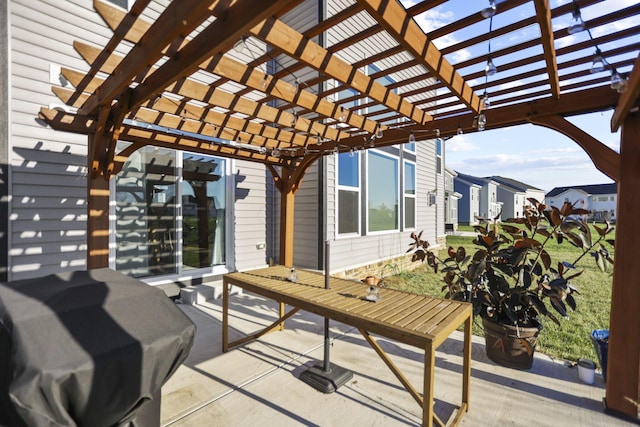 view of patio featuring a pergola and a grill