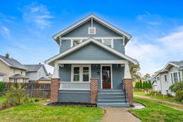 view of front of home with a front lawn and covered porch