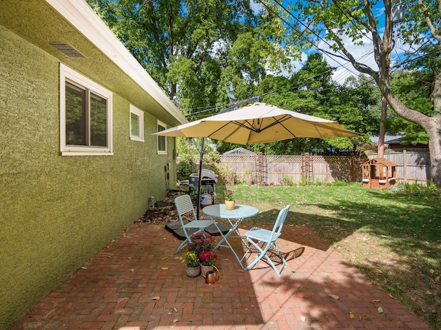 view of patio with a grill