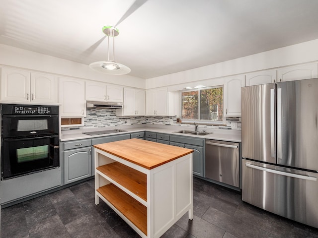 kitchen with gray cabinetry, white cabinetry, sink, a kitchen island, and black appliances