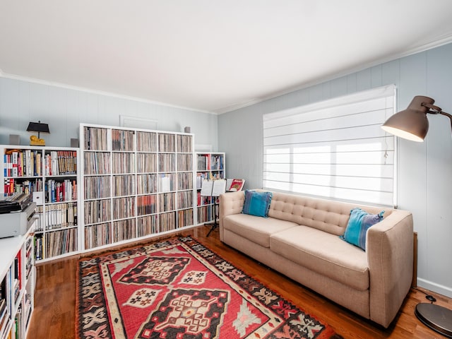 living room with ornamental molding and dark wood-type flooring