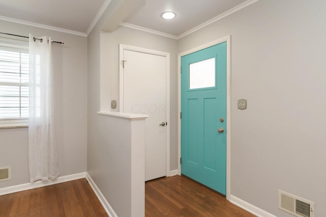 foyer featuring dark hardwood / wood-style flooring and ornamental molding