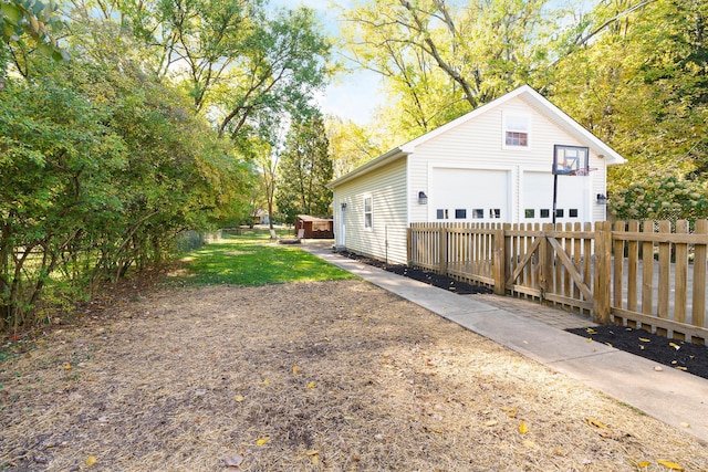 view of home's exterior featuring a garage and an outdoor structure