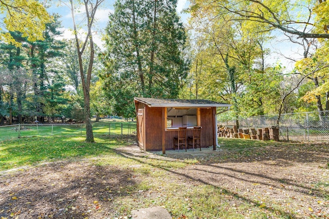 view of outbuilding with a lawn