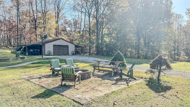 view of yard featuring an outbuilding and a garage